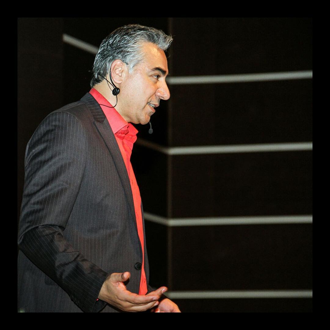 Shahram Taraghi speaking on stage